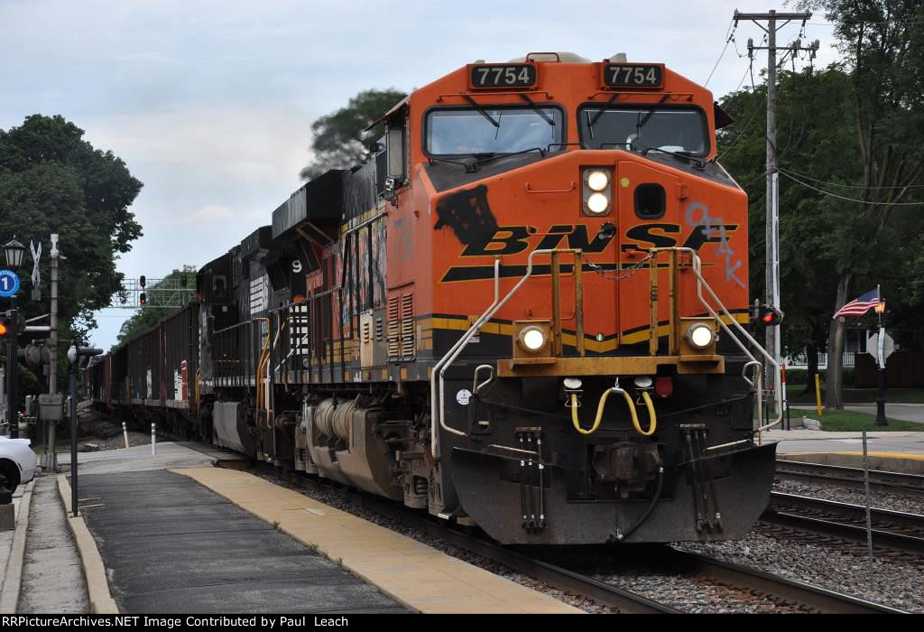 Manifest rolls west  through the station